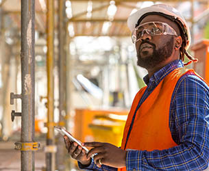African American engineer at work on construction site